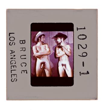 (MALE PHYSIQUE PHOTOS) A metal box of approximately 148 35mm slides depicting models in casual, studio, and outdoor settings, some iden